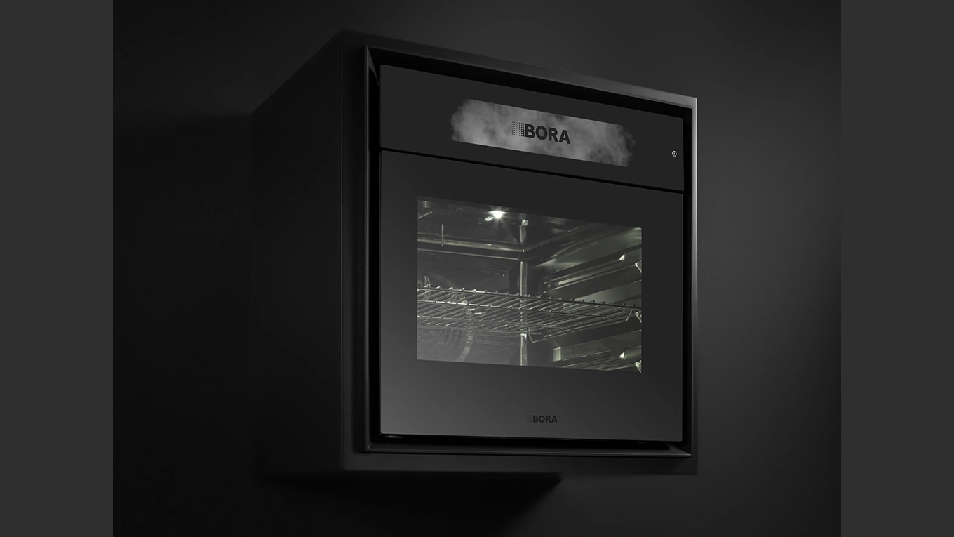 BORA X BO Backofen mit Dampf bora x bo dampfbackofen in schwarzer kulisse mit fokus auf den innenliegenden dampf