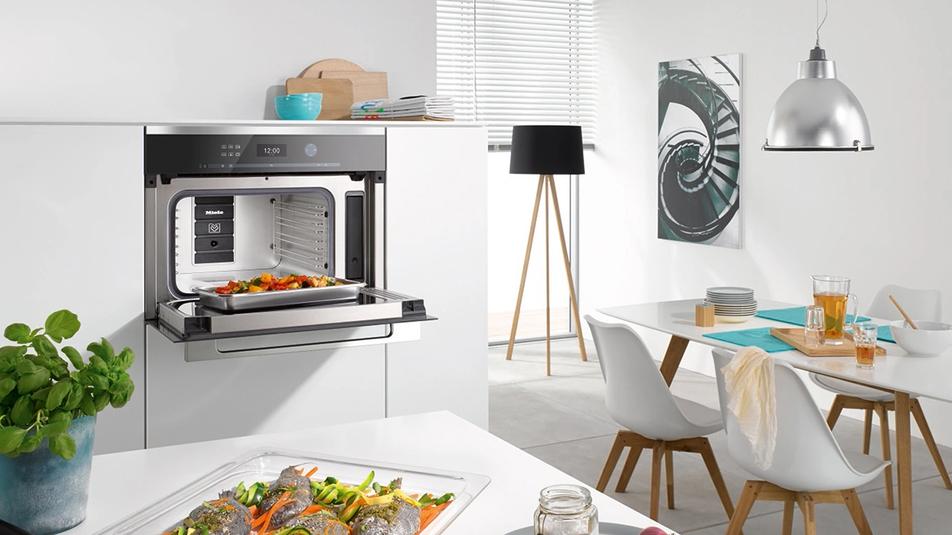 miele einbau backofen miele einbau backofen mit geöffneter tür in einem halbhohen küchenschrank